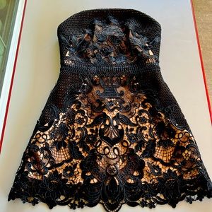 Beautiful strapless black sequence mini dress with beige inner lining.